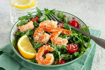 Shrimp salad with arugula and cherry tomatoes, with parmesan cheese, healthy food,
