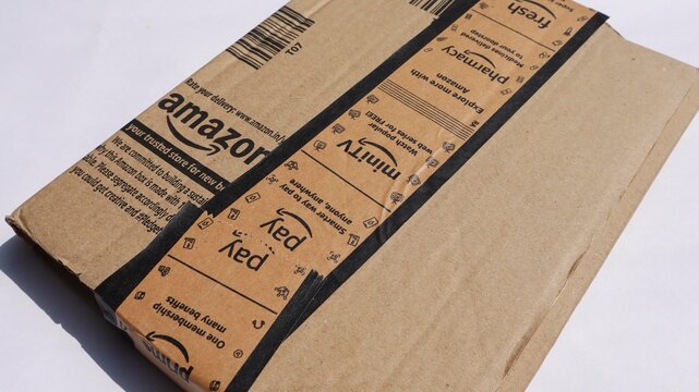 Amazon delivery parcel brown box. Amazon labeled with mini tv, fresh, pharmacy. Amazon India delivered on 10, may, 2025 in India