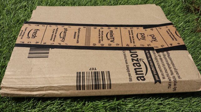 Amazon delivery parcel brown box. Amazon labeled with mini tv, fresh, pharmacy. Amazon India delivered on 10, may, 2025 in India