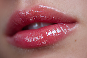 Obraz premium Glossy Lips Close-Up on Smooth Skin