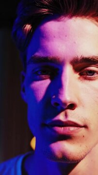 Cinematic Close-Up of Young Man with Dual-Tone Gel Lighting in Artistic Portrait