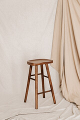 Bar chair on beige textile background