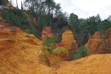 View of the colorful ocher rocks  in Roussillon, France on a cloudy day