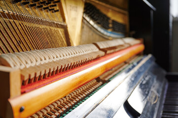 detailed close-up of piano strings highlighting intricate design and craftsmanship. perfect for music lovers, educators, and artistic projects emphasizing musical mechanics and artistry © khmelev