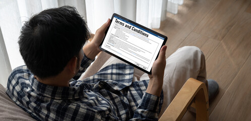 Naklejka premium Digital legal contract provide terms and conditions document on computer screen ready for online digital signature for deal agreement of future business snugly