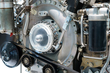 Detailed view of an automotive engine highlighting its complex components and mechanical design