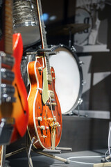 Electric guitars on display in a music museum highlighting various instruments and their history