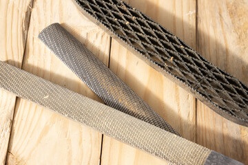 Close up of a Set of Rasps lying on wooden planks in a carpentry workshop