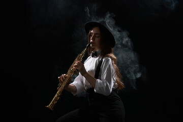 Musician playing soprano saxophone on dark background with smoke