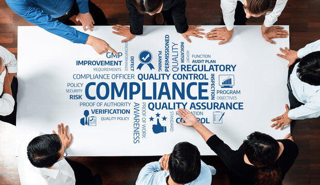 A group of professionals engaged in a compliance meeting, focusing on quality assurance and regulatory standards to improve business processes and ensure effective strategies. Amity