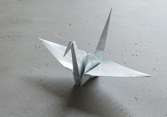 Origami Crane on Gray Surface