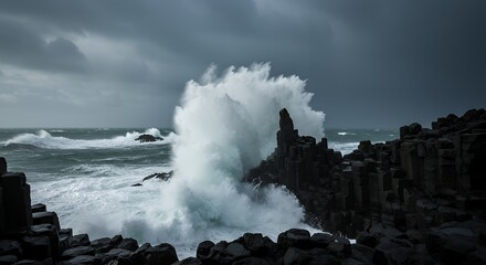 Dramatic Ocean Wave Crashing Against Dark Volcanic Rock Coastline