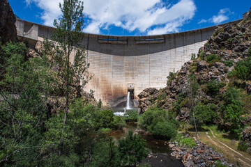 View of the concrete wall of the Riano lake dam in Spain