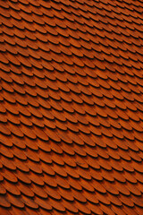 A breathtaking closeup image of terracotta roof tiles that create a warm and inviting aesthetic atmosphere