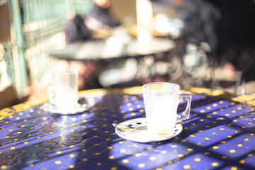 Empty coffee cups on a blue bar table close up