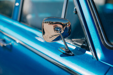 Chrome Side Mirror on Metallic-Blue Classic Car – Close-Up