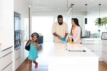 In kitchen, family preparing breakfast together, enjoying morning routine happily