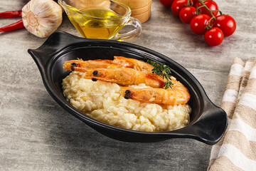 Italian risotto with prawn served thyme