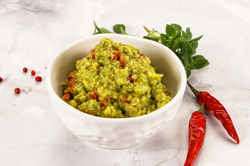 Guacamole with avocado, tomato and chili