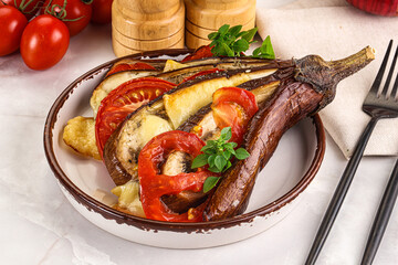 Baked tomato with mozzarella and tomato