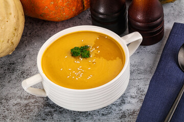 Vegan pumpkin cream soup served sesam