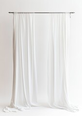 A pair of simple, plain white drapes hanging from a metal rod.  The fabric drapes softly and evenly, creating a clean and elegant look
