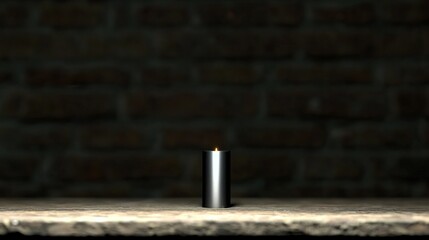 Burning candle with brick wall.