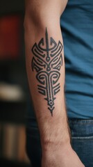 Intricate tribal tattoo design on a forearm.