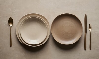 Elegant Table Setting with Neutral Tones and Gold Cutlery