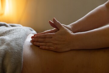 hands giving a therapeutic massage
