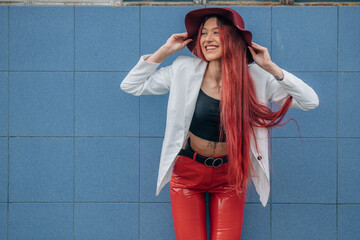 Fototapeta premium hipster girl with hat on the street looking