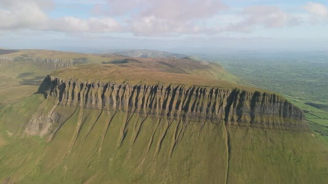 Spectacular 4K aerial video of flying about and above amazing Benbulbin mountain range at sunset, Sligo, Ireland