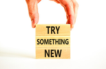 Try something new symbol. Concept words Try something new on beautiful block. Businessman's hand....