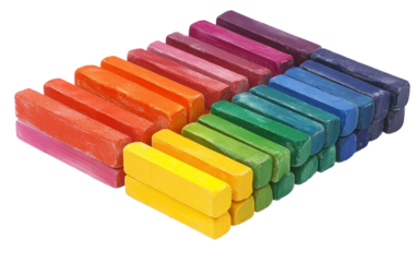 Clean set of colorful chalk pastels placed in perfect rainbow alignment inside a box ideal for creative drawing and blending