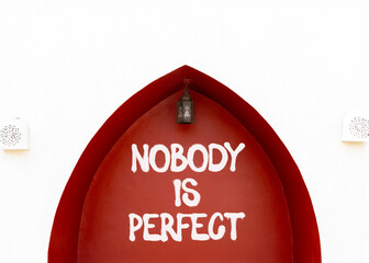 Nobody is perfect symbol. Concept words Nobody is perfect on beautiful white red wall. Beautiful...