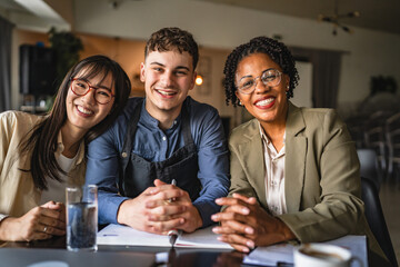 female financial advisers and young man entrepreneur on the meeting