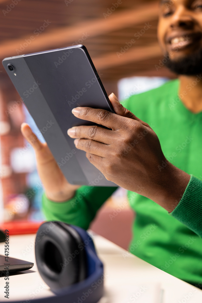 Aufkleber man at home taking break from work to look at social media feed on tablet. remote employee at work i