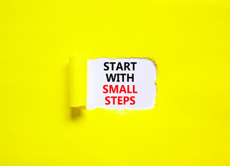 Start with small steps symbol. Concept words phrase Start with small steps on beautiful white paper. Beautiful yellow paper background. Business motivational Start with small steps concept. Copy space