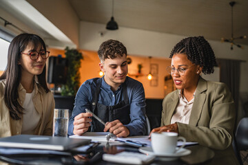 young man entrepreneur on the meeting with female financial advisers