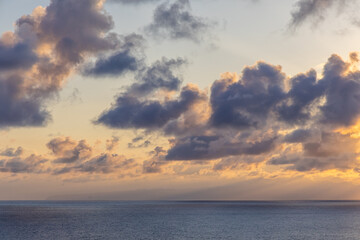 Dramatic Clouds Over Calm Pacific Ocean Near Hawaii at Sunset