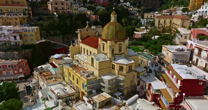 Aerial view of Positano. Marina Grande beach, town hall, Sant'Andrea duomo bell tower in Amalfi coast, Italy
