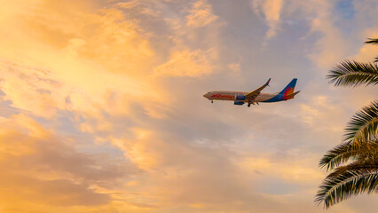 LANZAROTE, CANARY ISLANDS, SPAIN, 7th APRIL 2025: Jet2holidays passenger plane flies above palm...