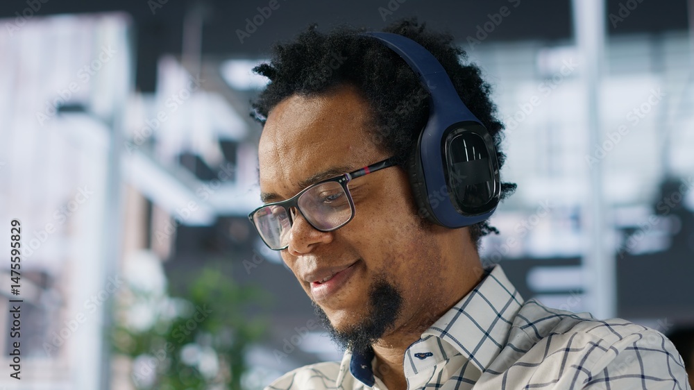 Poster executive assistant at a multinational company works with music on headphones, multitasking on busin