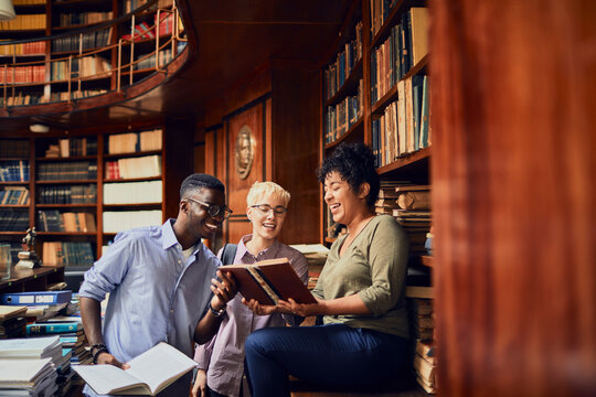 Young and diverse group of students studying in a university library