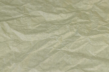 part of a sheet of paper crumpled after use