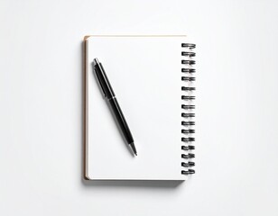 Top view of spiral notebook with black pen