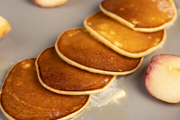 melting butter on pancakes from milk with flour , closeup