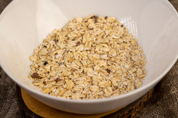 oatmeal porridge with dried fruits mixed with porridge, dried fruits and berries to give a pleasant taste to the finished oatmeal