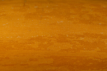orange peel of a ripe pumpkin or zucchini, details of the peel of a ripe zucchini, striped peel