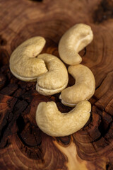 cashew are scattered on a board, cashew nuts are healthy and allowed for vegans. , top view